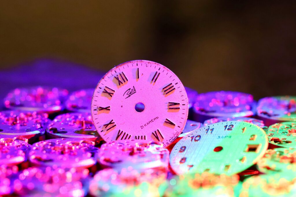 Vibrant arrangement highlighting vintage watch faces with Roman numerals.